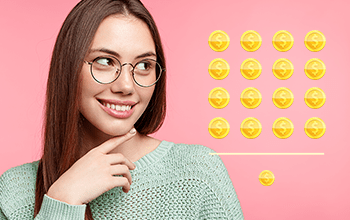 female with glasses staring at gold coins